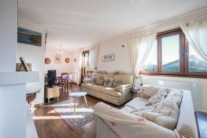 a living room with a couch and a table at Chalet Jarrier 1400 in Jarrier