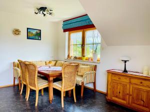 a dining room with a table and chairs at Haus Rosenheim in Ramsau am Dachstein