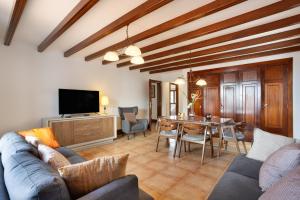 a living room with a couch and a table at Finca Bellavista in Teguise