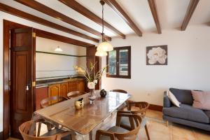 a dining room with a table and chairs at Finca Bellavista in Teguise