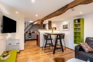 a kitchen and living room with a table and chairs at Ferienhaus Mittendrin in Jesberg