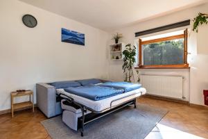 a hospital bed in a room with a window at Panoramic Green Studio in Malcesine