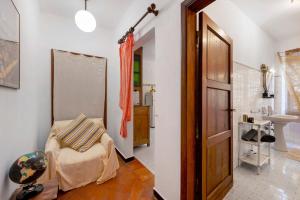 a room with a bed and a bathroom with a sink at Agriturismo Monte Pu' in Castiglione Chiavarese +179 photos