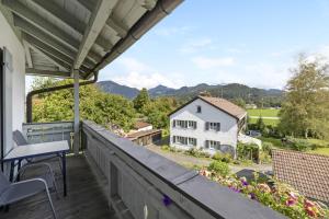 a balcony with a view of a house at Fewo Brünnstein - Nr 47 Pool, Sauna in Oberaudorf