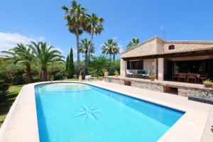 a swimming pool in front of a house at Sa Vinyeta de Son Jaumell in Capdepera +21 photos