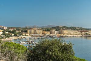 a group of boats docked in a harbor at Le Giare 2 in La Maddalena