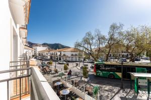 a bus is parked on a street in a city at Mirage Mijas centro in Mijas