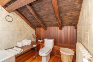 a bathroom with a toilet and a sink at Cobert de Felip in Gavas +21 photos