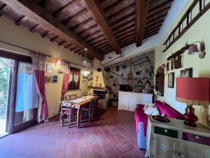 a kitchen with a table and a dining room at Il Forcone in Panicale