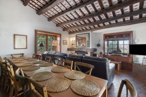 a group of tables and chairs in a room at Mas Juli in Pineda de Mar