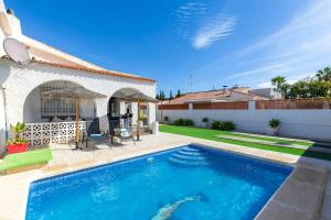 a swimming pool in the backyard of a house at Fidalsa Relax Pool your Refuge in Torrevieja