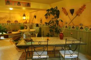 a dining room with a table and chairs in a room at Gite Les Trois Collines in Cuisiat +13 photos