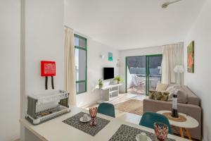 a living room with a couch and a table at Casa Orballo in Mogán