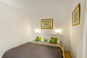 a bed in a room with two pillows on it at Casa Orballo in Mogán +15 photos