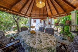 a dining room with a table and chairs at House Theodora holidays Greece in Dragotiná
