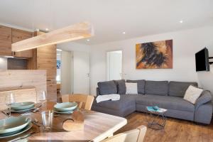 a living room with a couch and a table at Ignazhof in Horben