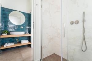 a bathroom with a shower and a sink at Taormina Center Suite in Taormina