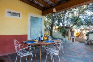 a wooden table and chairs on a patio at S' Alzina in Sencelles