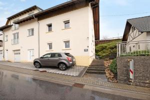 a car parked in front of a house at Fewo Traumschleife Nohen in Nohen
