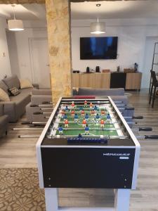 a large foosball table in a living room at Villa Dehesa in Tabernas