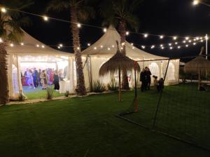 a tent with a group of people dancing under lights at Villa Dehesa in Tabernas