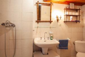 a bathroom with a sink and a shower and a toilet at Maison à Sigean in Sigean