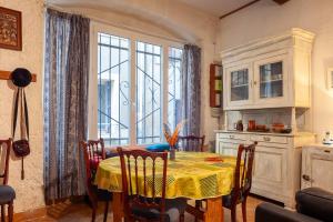 a kitchen with a table and a large window at Maison à Sigean in Sigean +17 photos
