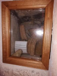 a wooden box with a bunch of objects in it at O Lar de Natalio in Rianjo