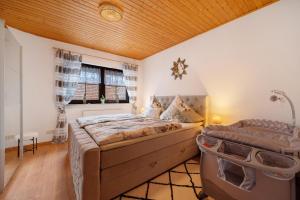 a bedroom with a large bed and a window at Betty’s Home in Gersheim