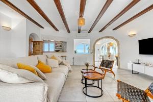 a living room with a couch and a table at Adriana in Denia