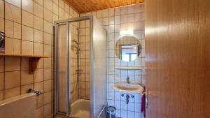 a bathroom with a sink and a shower at Fewo Jörges in Obernhausen +15 photos