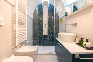 a bathroom with a sink and a toilet and a shower at Civico40 Suite in Locorotondo +21 photos