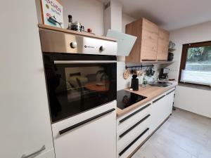a kitchen with a stainless steel oven and a counter at Ferienwohnung Rheinnähe in Bad Säckingen
