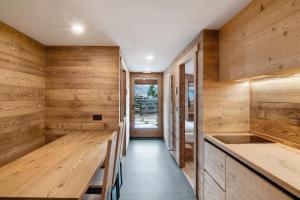 a sauna with wooden walls and a wooden bench at Agriturismo Montespluga in Madesimo