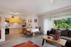 a living room with a couch and a table at Birkenhauer inkl Meine Card plus in Willingen