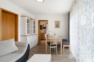 a living room with a couch and a table at Ferienwohnung Honberg in Tuttlingen