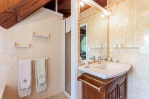 a bathroom with a sink and a mirror at Maison d'hôtes, Calme et Piscine in Habas +48 photos