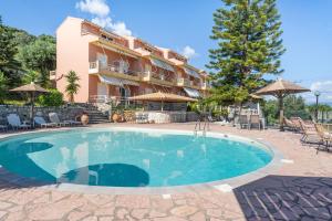 a large swimming pool in front of a building at Stefanos place Studio sea View 7 in Corfu