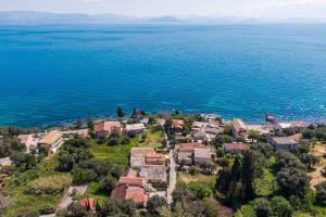an aerial view of a small village by the water at Villa Marianthi-kaizer Bridge in Achílleion