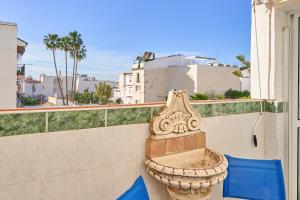 a stone planter sitting on the side of a building at Butterfly apartment in Nerja