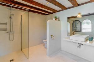 a bathroom with a shower and a sink and a toilet at Costa del Sol Retreat - 17 personas in Mijas +23 photos