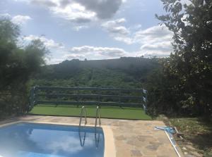 a swimming pool with a view of the mountains at Gite Chez Lucien in Trébas