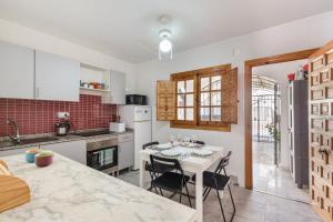 a kitchen with a table and chairs in a room at 53 Luz Bahia in Mazarrón