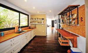 a kitchen with a sink and a wooden counter at וילה levi in Chorazim