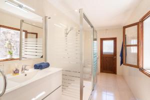 a bathroom with a shower and a sink at Casa Tramuntana in Sóller +15 photos