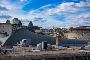 a view of the roofs of a city with buildings at Chez Emilien in Bordeaux
