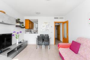 a living room with a couch and a table at Topete Alicante in Alicante