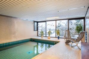 a pool in a house with a swimming pool at Schwarzwaldblick K App 4 mit Pool in Schönwald