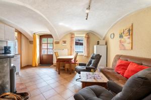 a living room with a couch and a table at Ferienwohnung Ahrens in Ehrenberg