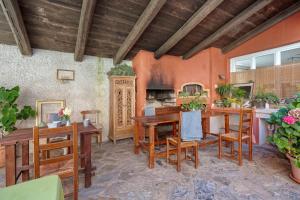 a dining room with wooden tables and chairs at Agriturismo Monte Pu' in Castiglione Chiavarese